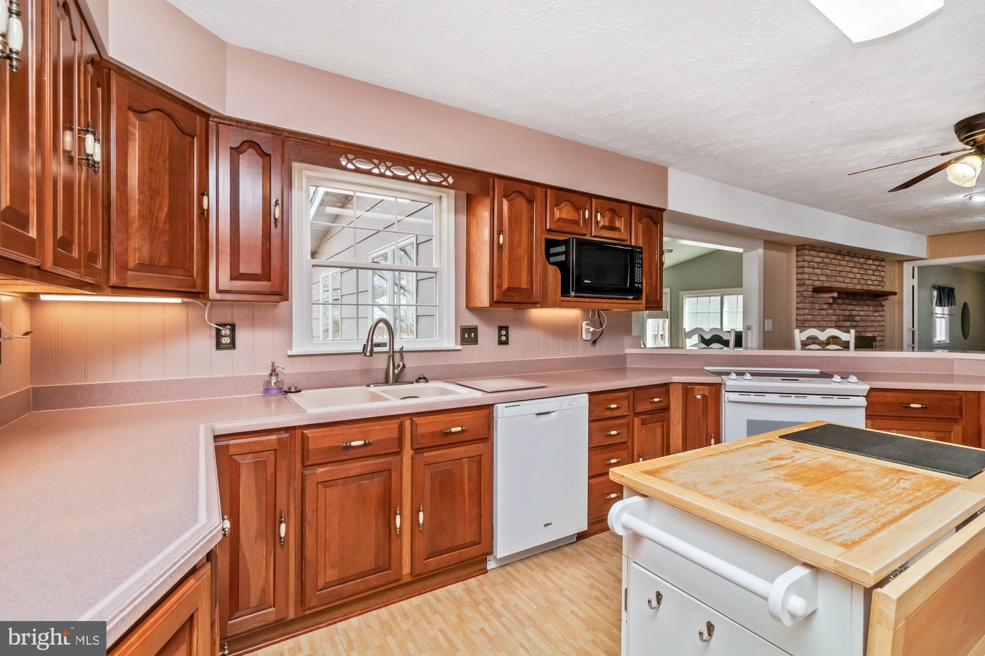 529 Beards Hill Road Aberdeen, MD 21001 - Photo 23 of 65 a kitchen with a sink stove and cabinets