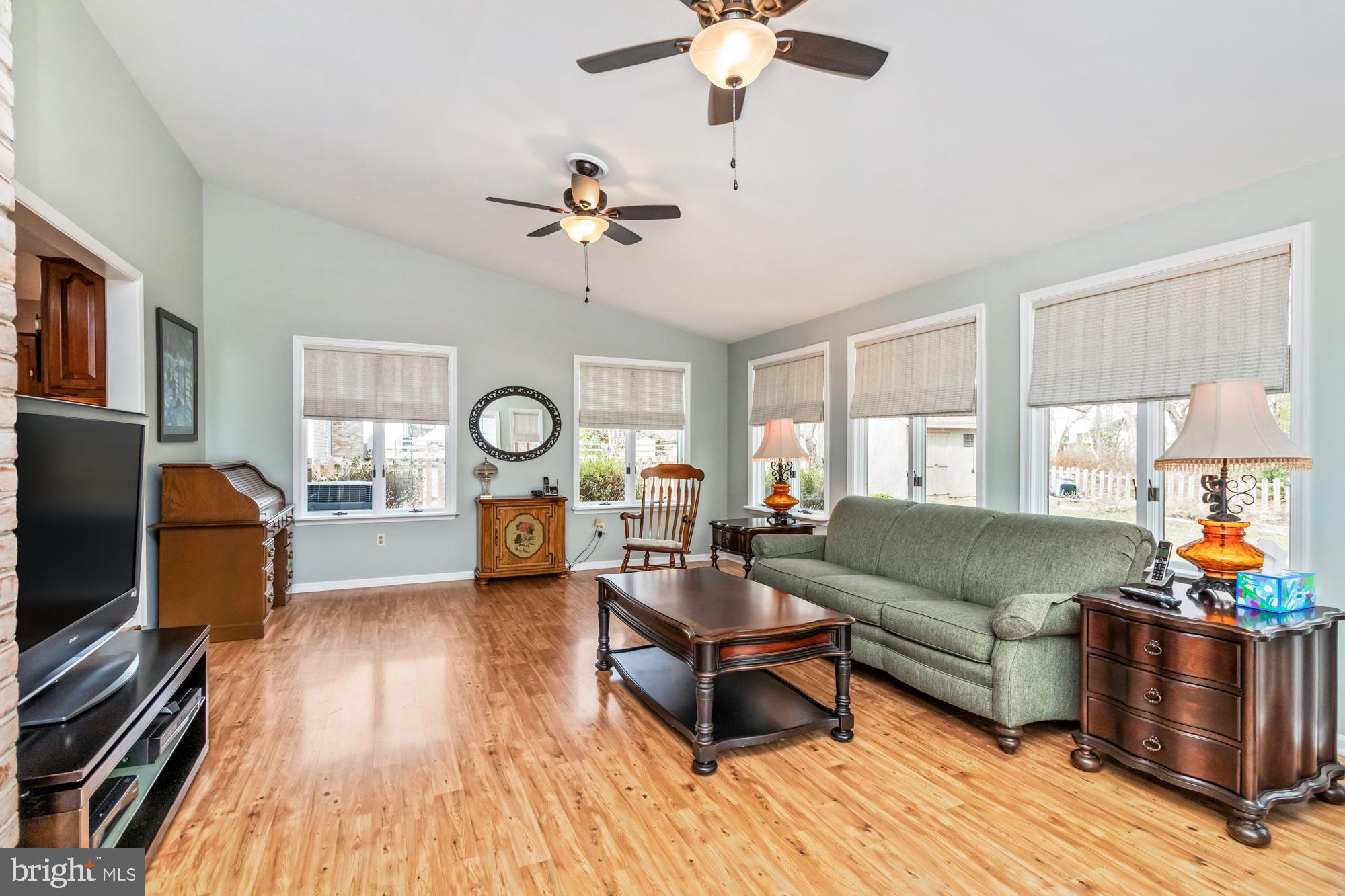 529 Beards Hill Road Aberdeen, MD 21001 - Photo 26 of 65 a living room with furniture a fireplace and a flat screen tv