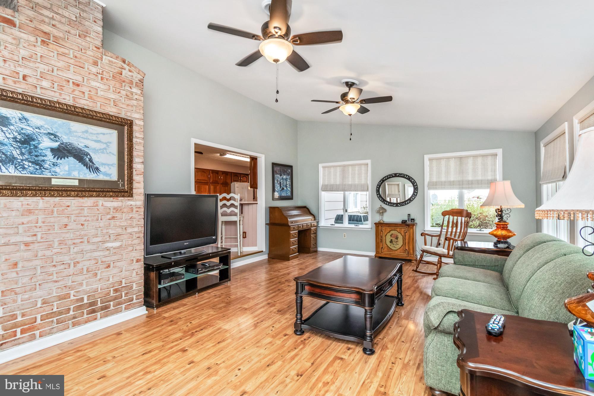 529 Beards Hill Road Aberdeen, MD 21001 - Photo 27 of 65 a living room with furniture a flat screen tv and a window