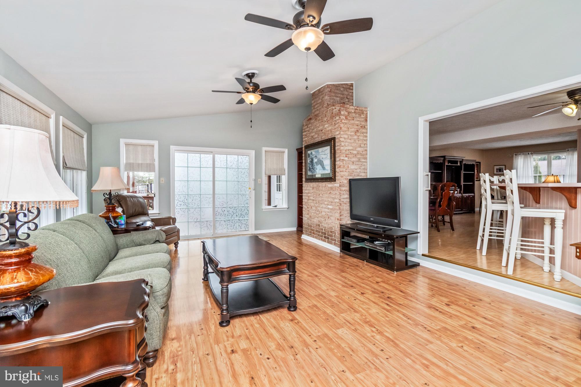 529 Beards Hill Road Aberdeen, MD 21001 - Photo 28 of 65 a living room with furniture and a flat screen tv