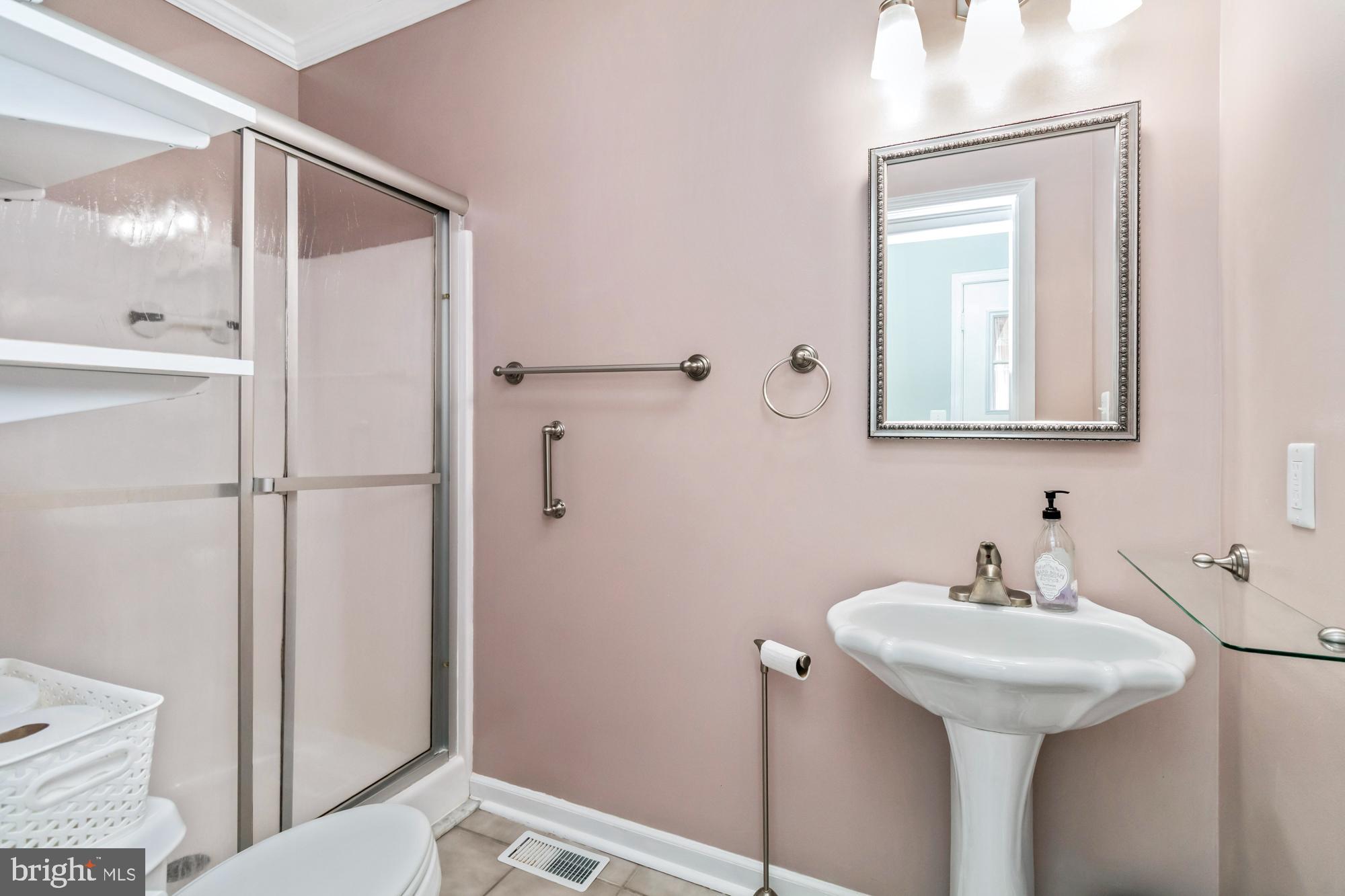 529 Beards Hill Road Aberdeen, MD 21001 - Photo 29 of 65 a bathroom with a sink a mirror and a toilet
