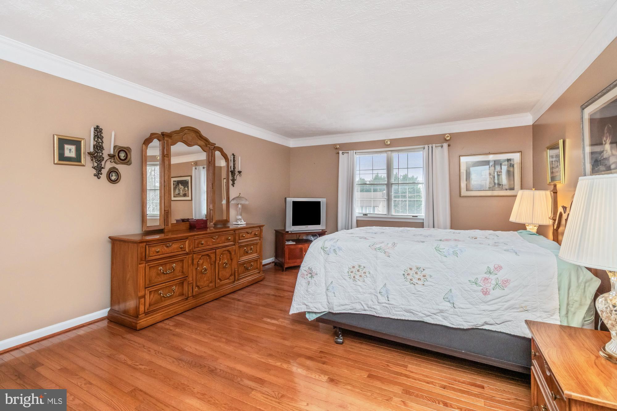 529 Beards Hill Road Aberdeen, MD 21001 - Photo 33 of 65 a bedroom with a bed and wooden floor
