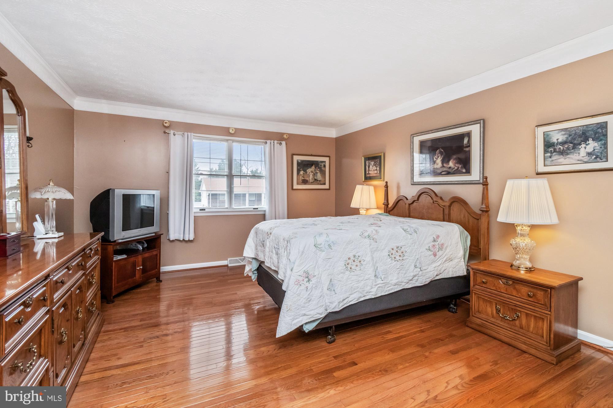 529 Beards Hill Road Aberdeen, MD 21001 - Photo 34 of 65 a bedroom with a bed and a flat screen tv