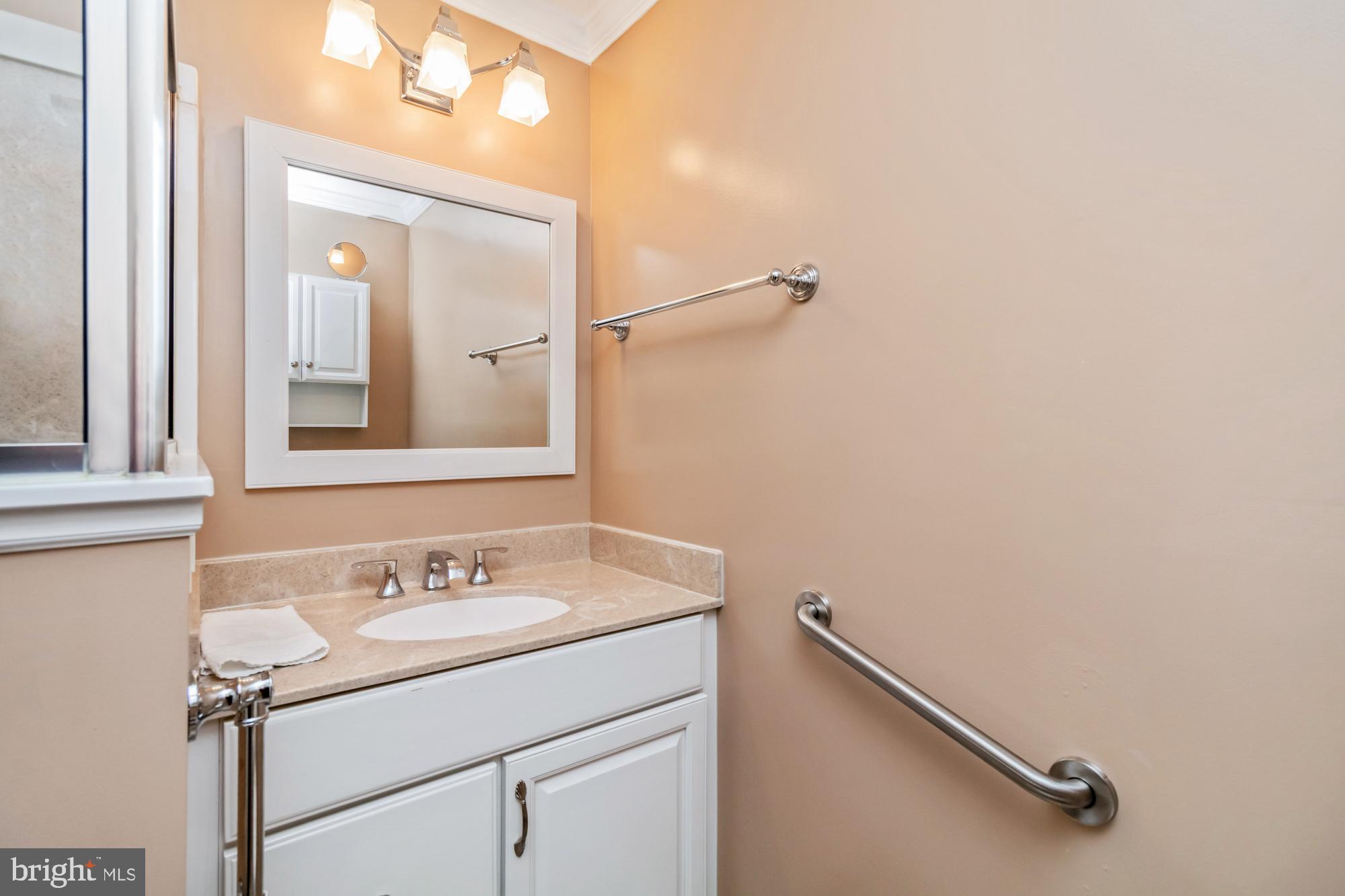 529 Beards Hill Road Aberdeen, MD 21001 - Photo 37 of 65 a bathroom with a sink mirror and vanity