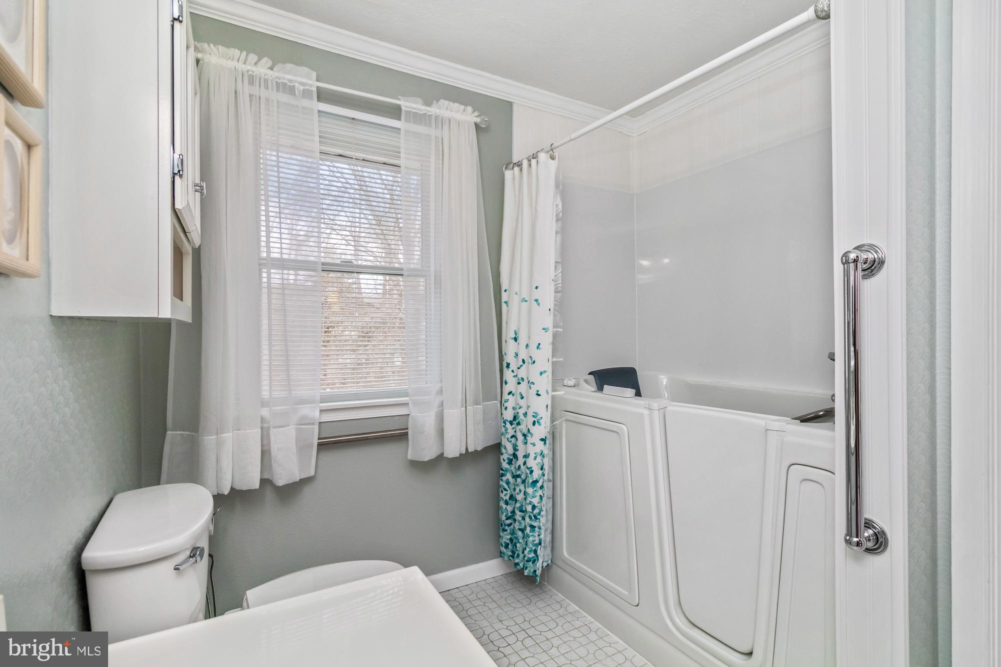 529 Beards Hill Road Aberdeen, MD 21001 - Photo 39 of 65 a bathroom with a toilet a sink and shower
