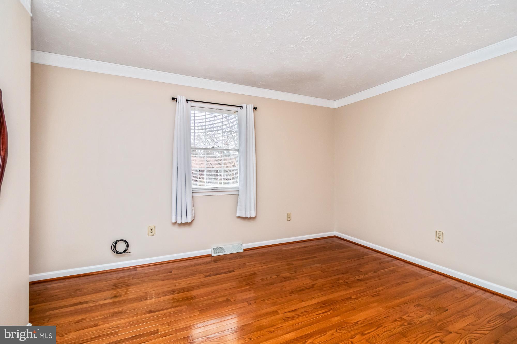 529 Beards Hill Road Aberdeen, MD 21001 - Photo 40 of 65 an empty room with wooden floor and windows