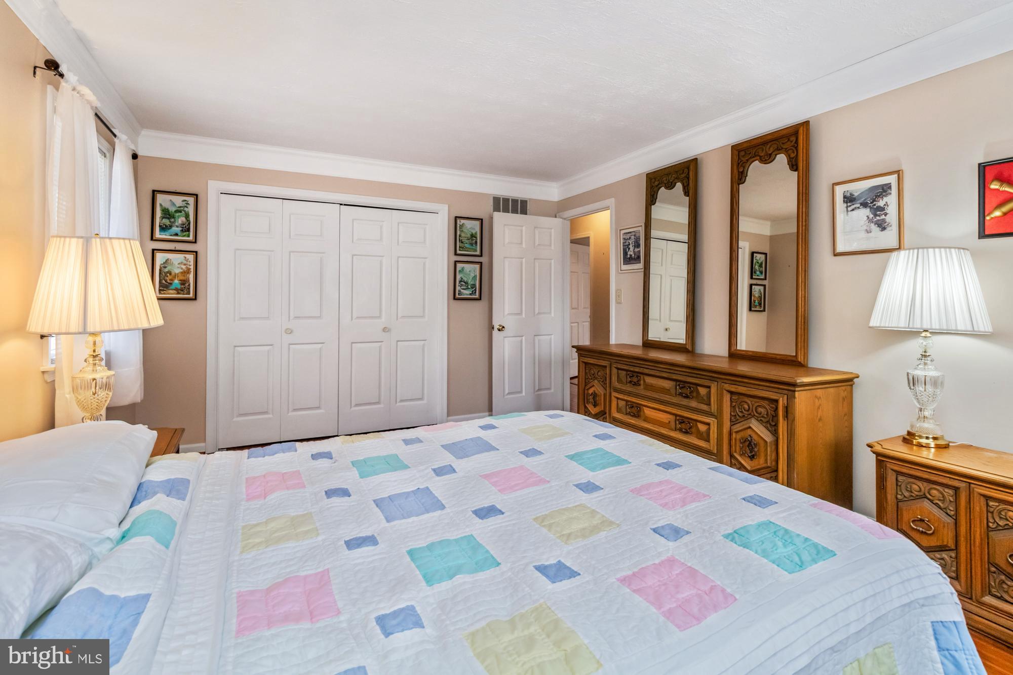 529 Beards Hill Road Aberdeen, MD 21001 - Photo 44 of 65 a bedroom with a bed and a lamp on dresser