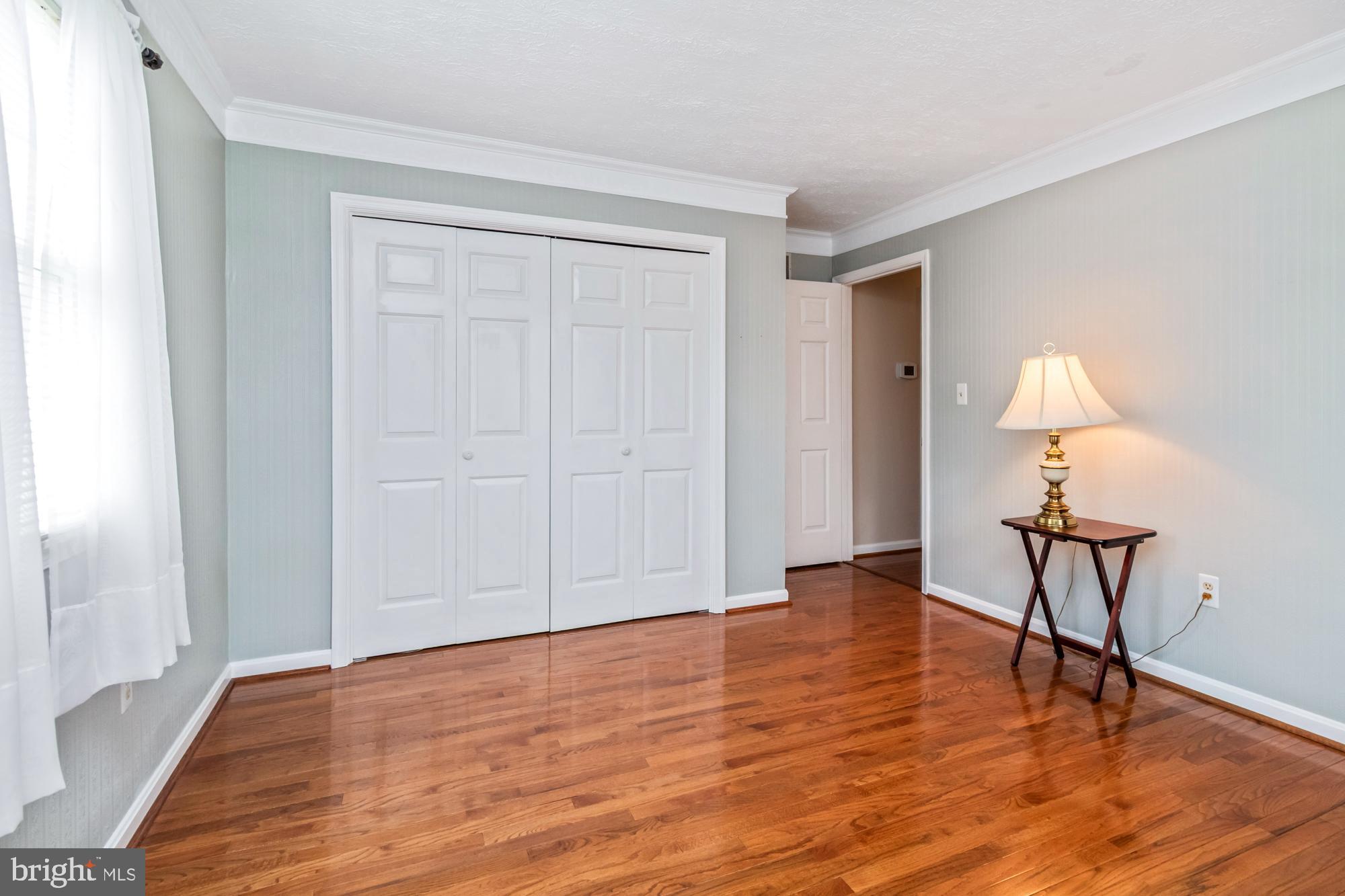 529 Beards Hill Road Aberdeen, MD 21001 - Photo 46 of 65 a view of an empty room with wooden floor and a window