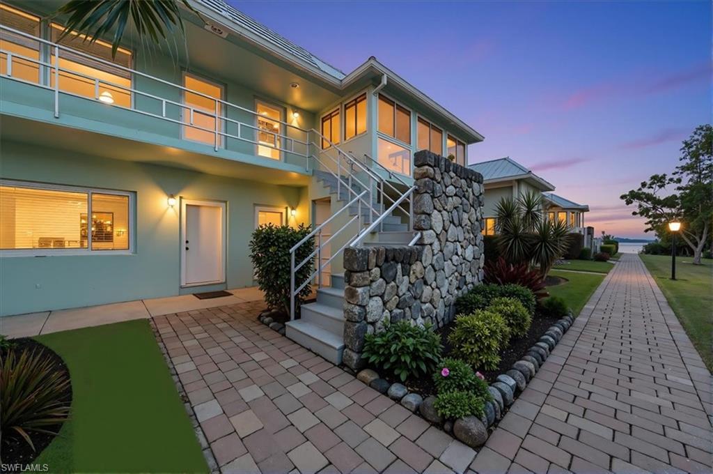 3225 East Riverside Drive, Unit 17A Fort Myers, FL 33916 - Photo 1 of 30 Doorway to property featuring stucco siding and a patio area