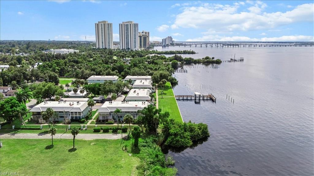 3225 East Riverside Drive, Unit 17A Fort Myers, FL 33916 - Photo 21 of 30 Bird's eye view of a notable bridge, a large body of water, and skyline
