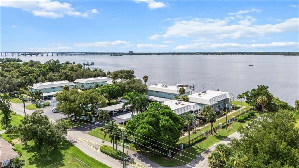 3225 East Riverside Drive, Unit 17A Fort Myers, FL 33916 - Photo 29 of 30 Aerial view of a notable bridge and a large body of water