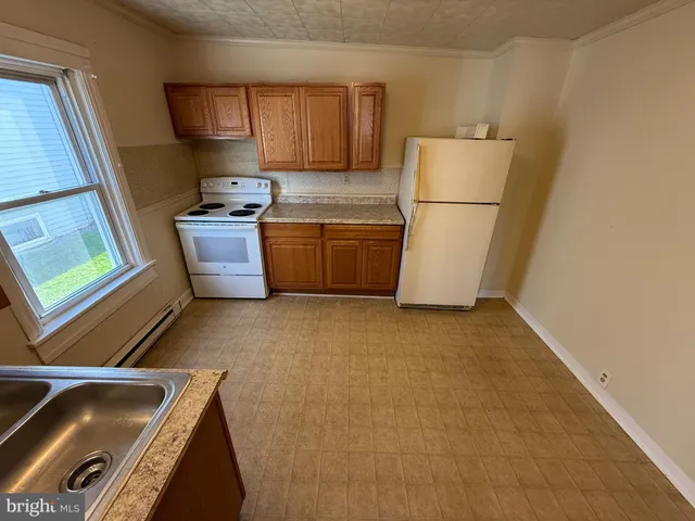 a room with a sink and a cabinets