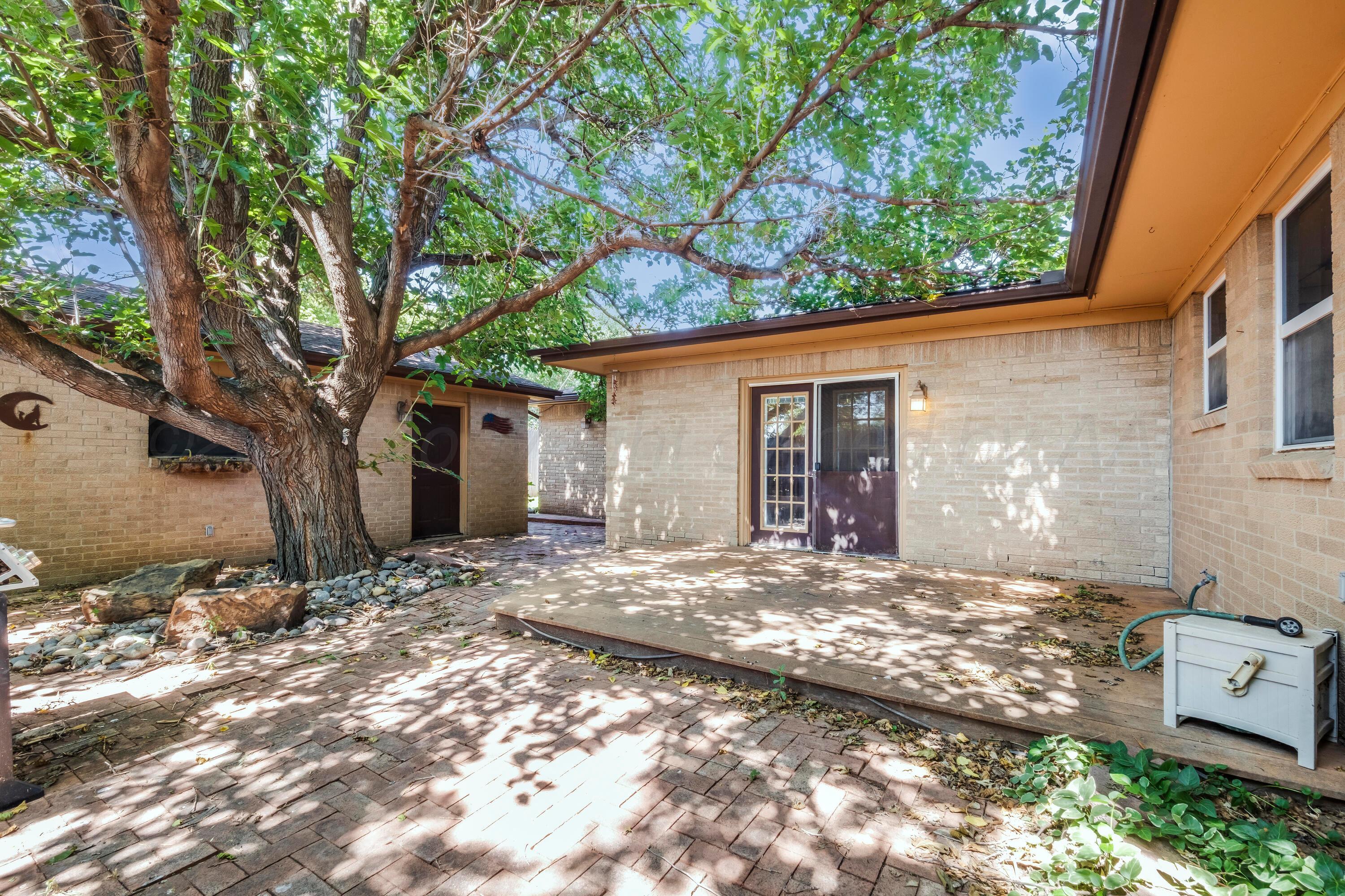 2401 Darrell Avenue Amarillo, TX 79110 - Photo 26 of 35 a view of a house with a tree in front of it