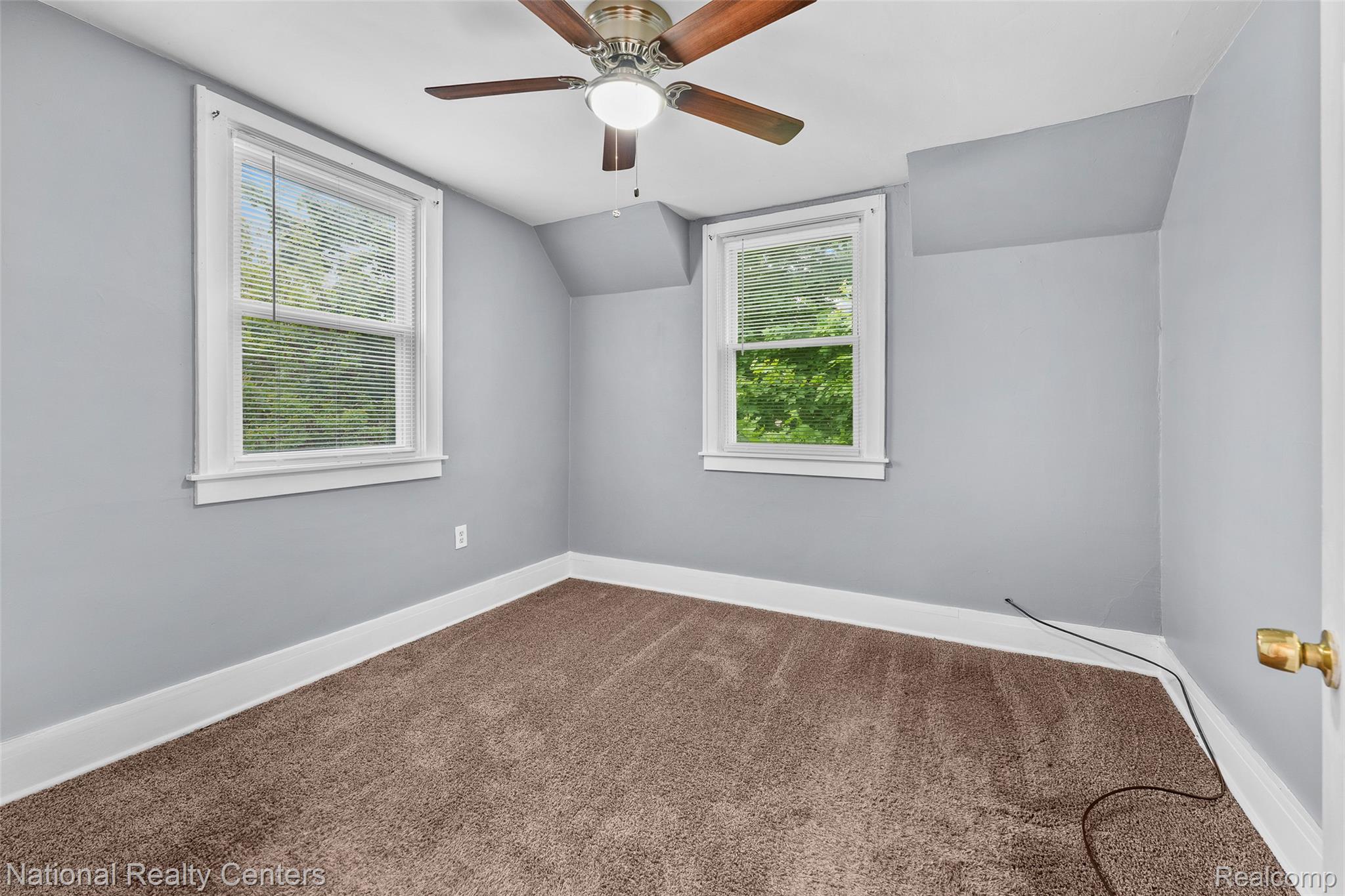 686 Perry Street Pontiac, MI 48342 - Photo 16 of 26 Additional living space featuring carpet flooring, ceiling fan, and vaulted ceiling