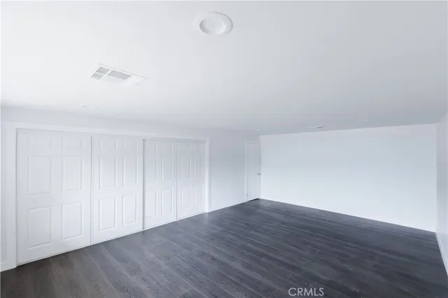 a view of room with hardwood floor