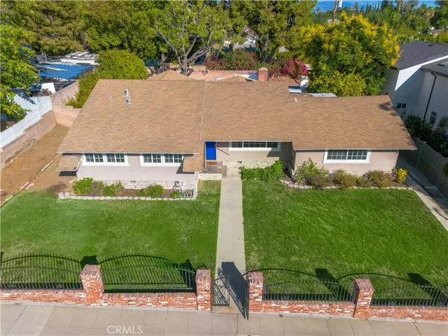 an aerial view of a house with garden