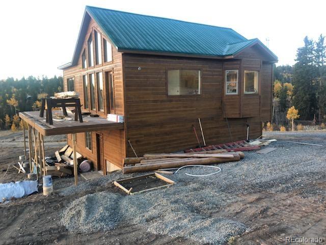 6122 Remington Road Como, CO 80432 - Photo 5 of 5 a front view of a house with parking space