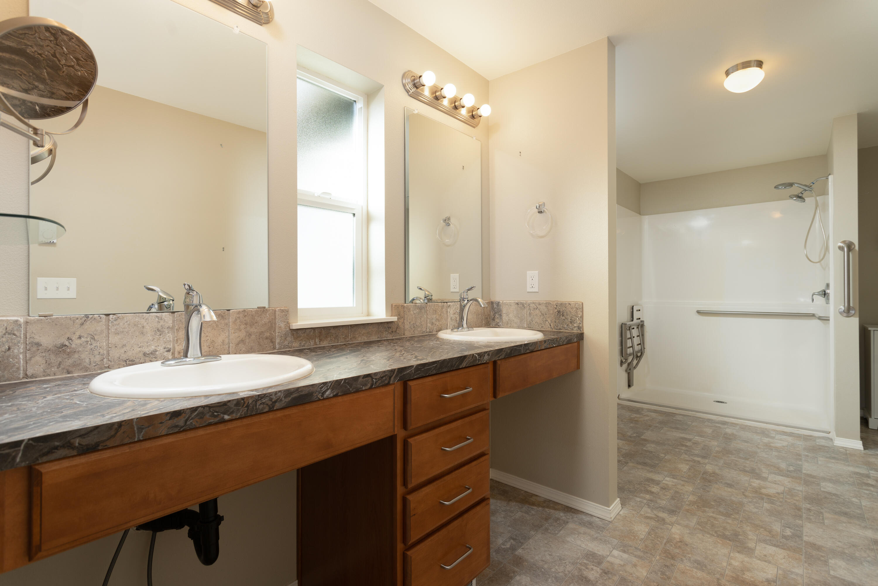 70099 Indian Ford Road Sisters, OR 97759 - Photo 19 of 27 a bathroom with a granite countertop sink and a mirror