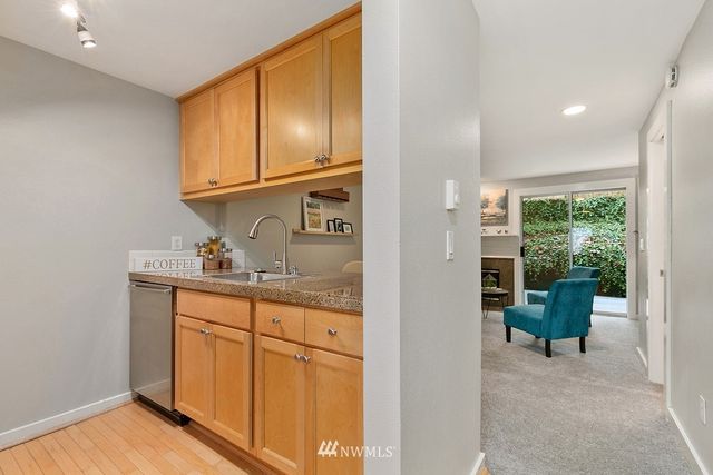 a kitchen with cabinets a sink and appliances