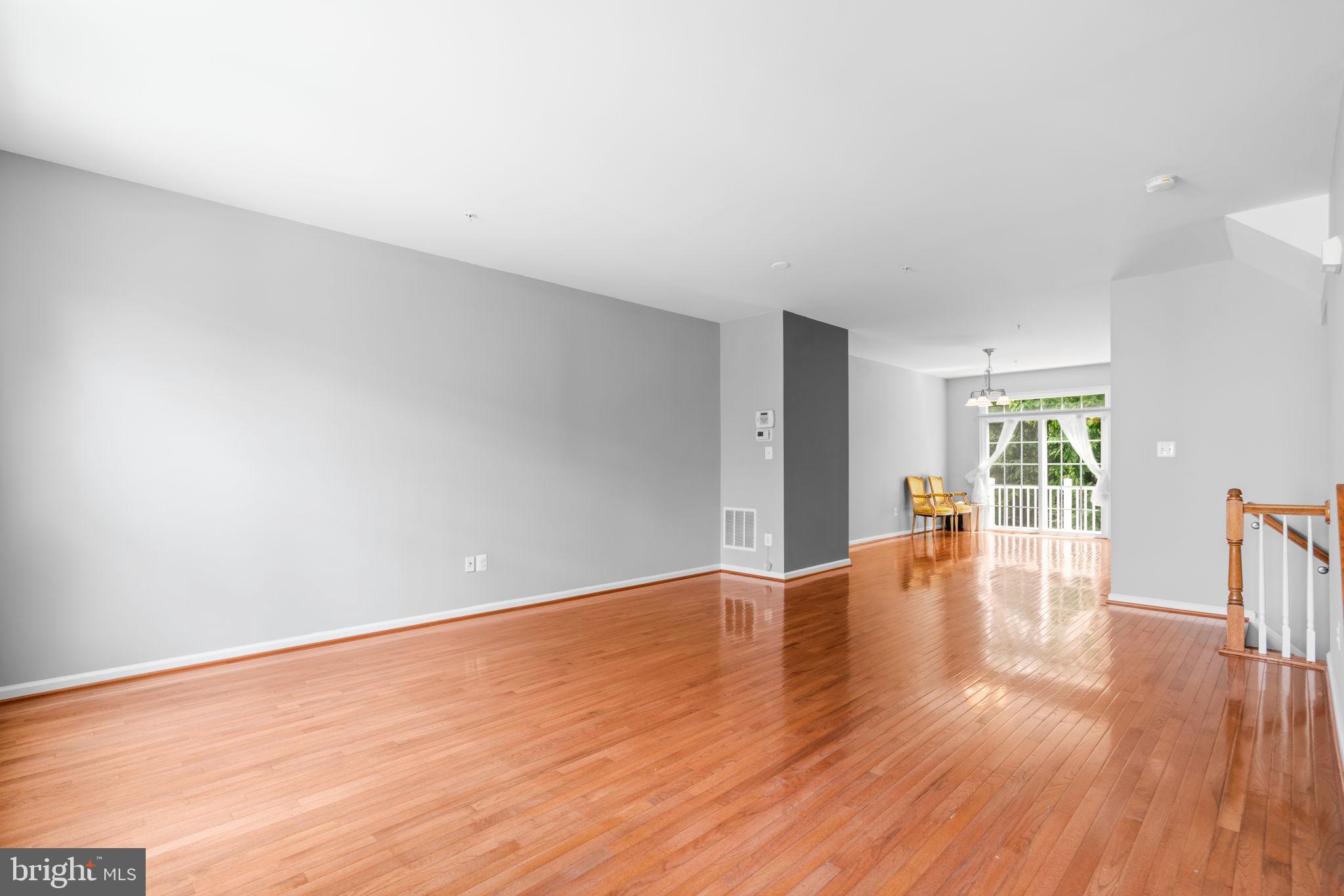 11646 Leesborough Circle Wheaton, MD 20902 - Photo 18 of 46 a view of an empty room with wooden floor and a window
