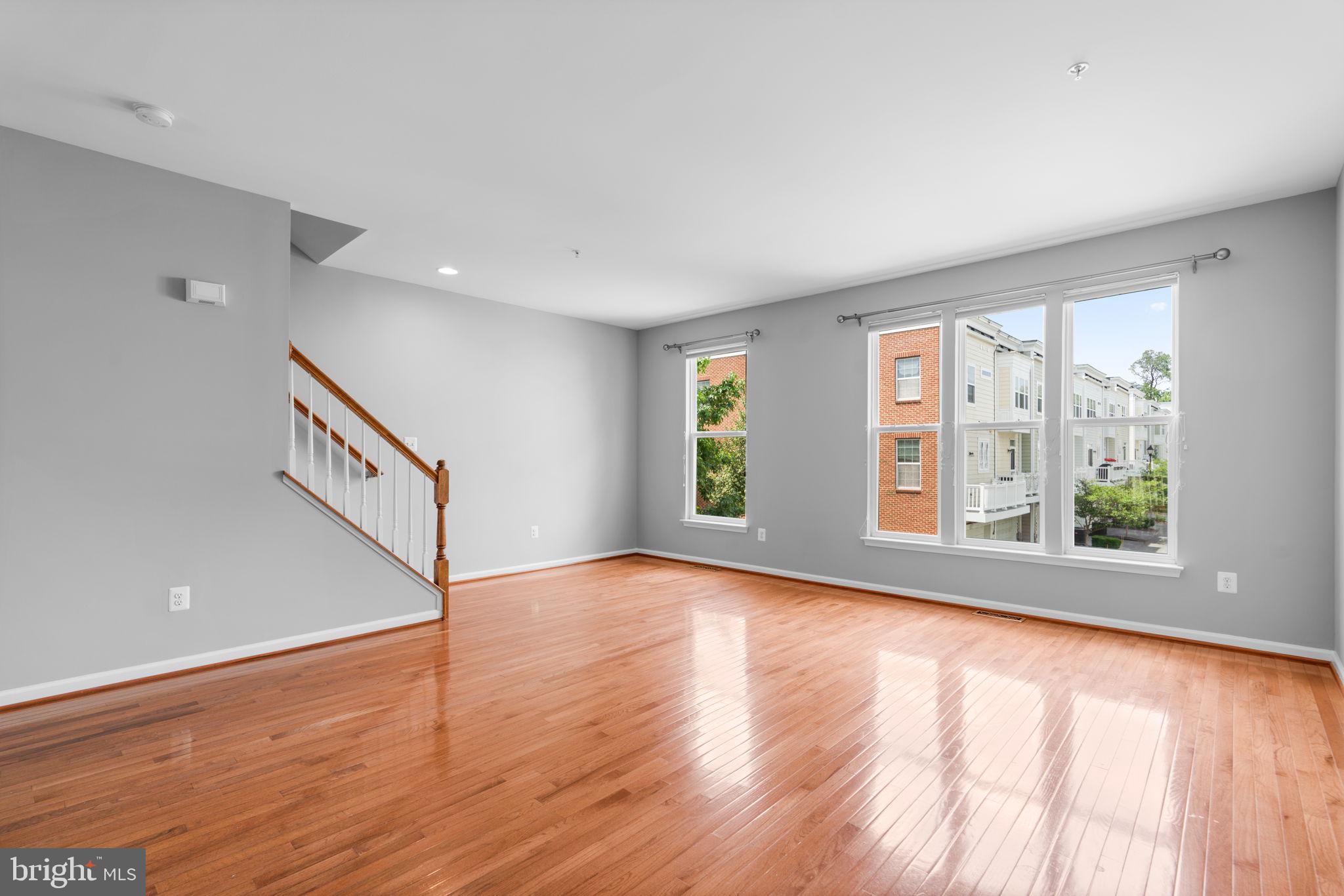 11646 Leesborough Circle Wheaton, MD 20902 - Photo 21 of 46 a view of an empty room with wooden floor and a window