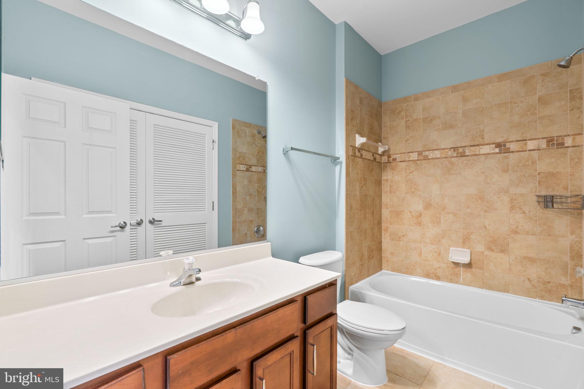 11646 Leesborough Circle Wheaton, MD 20902 - Photo 28 of 46 a bathroom with a sink a toilet and shower