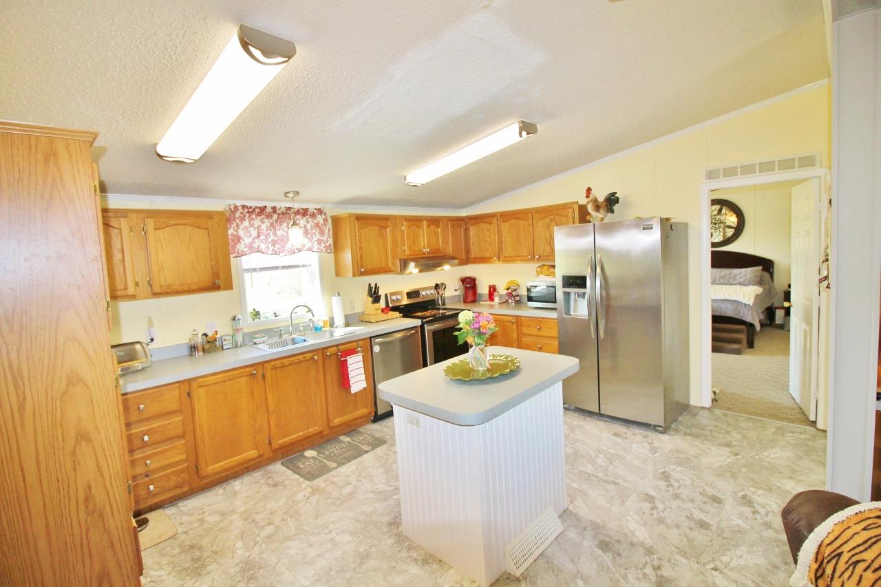 1119 Maple Hill Road Lebanon, TN 37087 - Photo 12 of 30 a kitchen with a refrigerator and a sink
