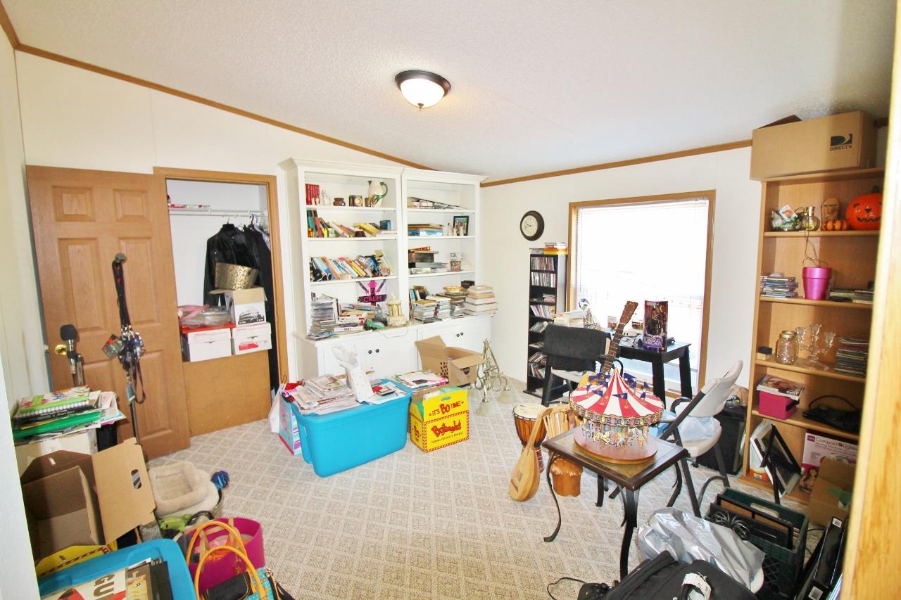 1119 Maple Hill Road Lebanon, TN 37087 - Photo 23 of 30 a living room with furniture and a chandelier