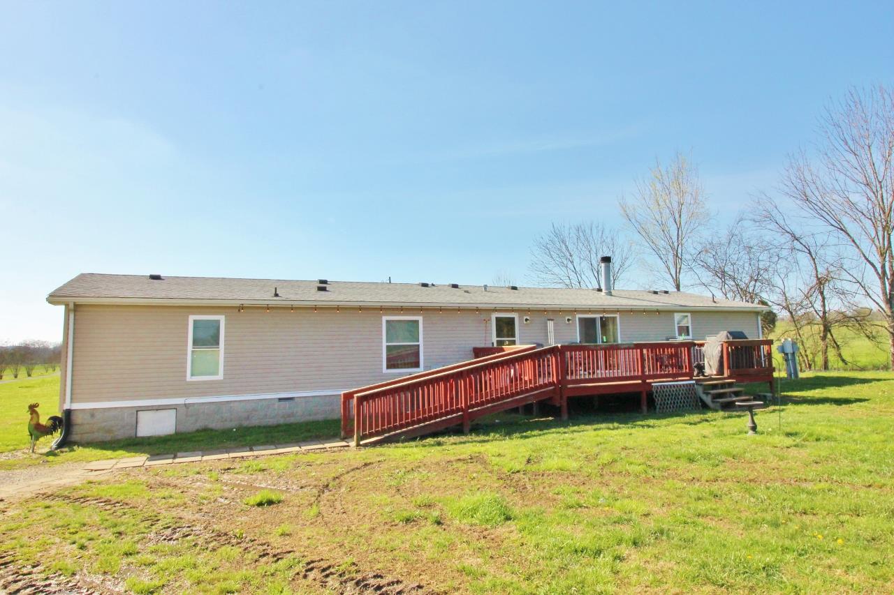 1119 Maple Hill Road Lebanon, TN 37087 - Photo 28 of 30 a backyard of a house with barbeque oven and seating space