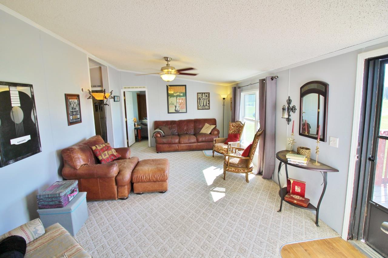 1119 Maple Hill Road Lebanon, TN 37087 - Photo 8 of 30 a living room with furniture and a flat screen tv