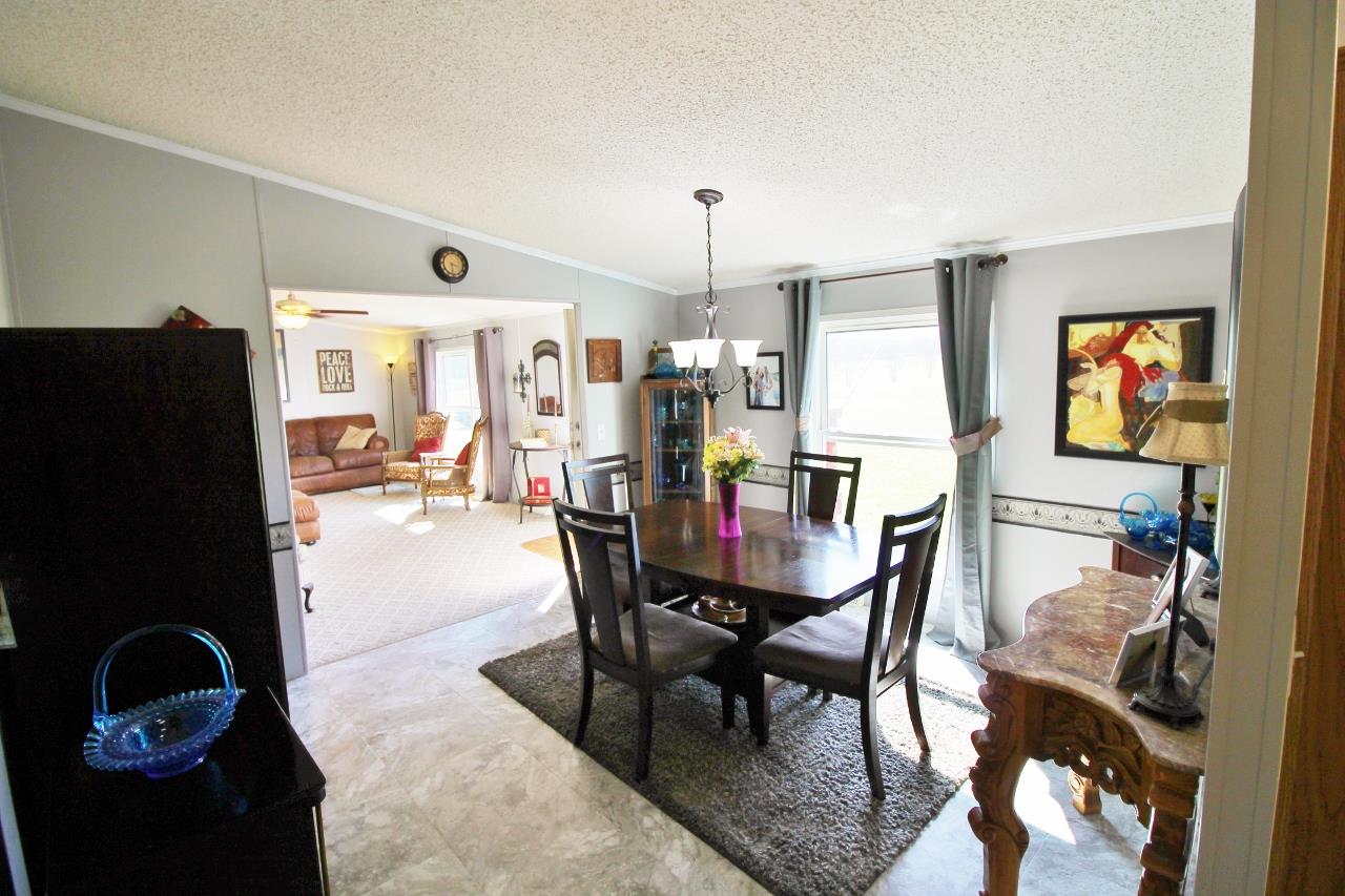 1119 Maple Hill Road Lebanon, TN 37087 - Photo 9 of 30 a view of a dining room with furniture and chandelier