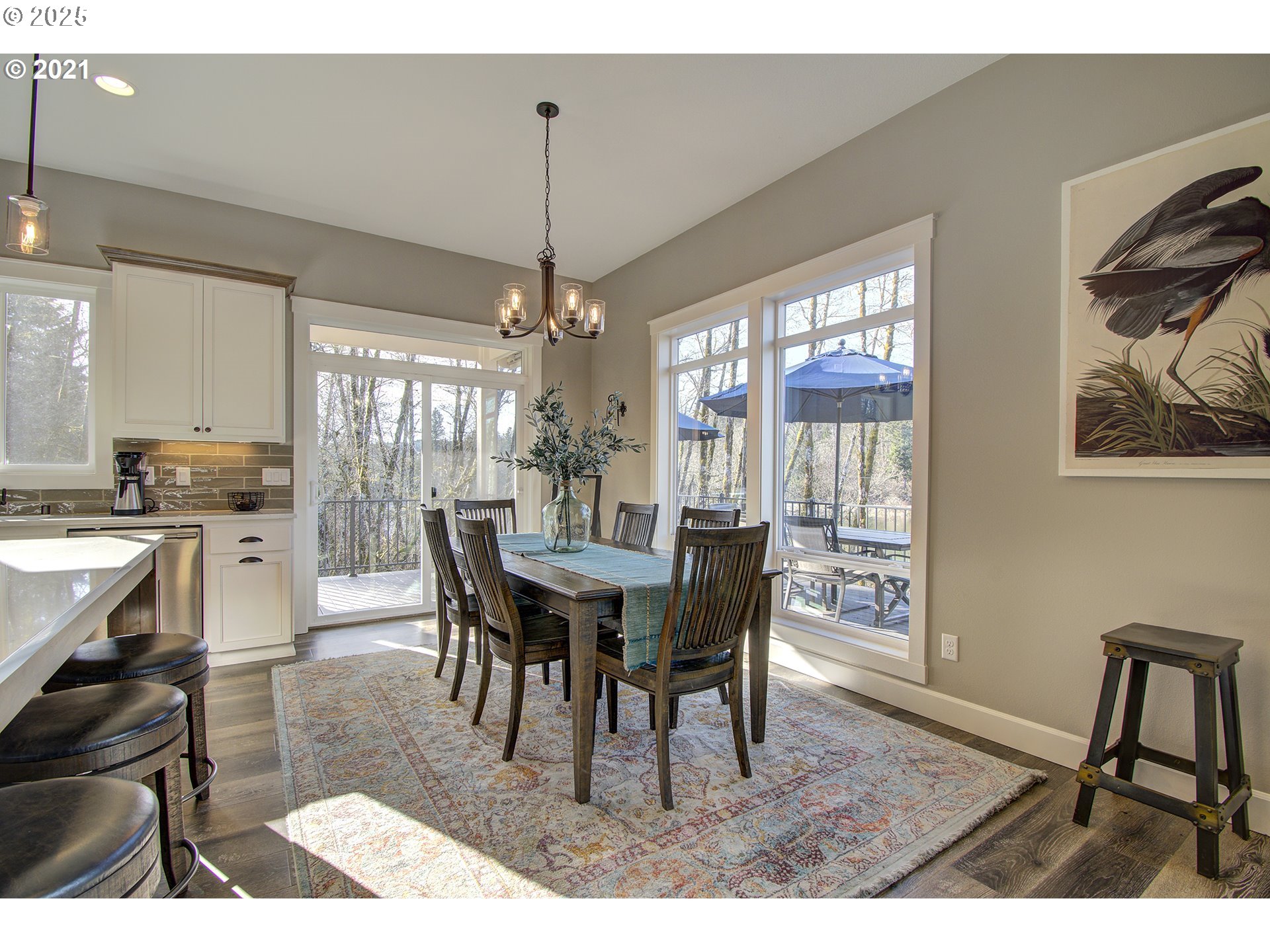 15116 Northeast Grantham Road Amboy, WA 98601 - Photo 4 of 9 a dining room with furniture a chandelier and wooden floor