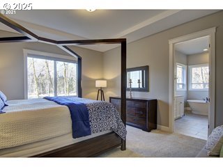 15116 Northeast Grantham Road Amboy, WA 98601 - Photo 9 of 9 a bedroom with a bed and wooden floor