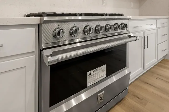 a view of cabinets and wooden floor