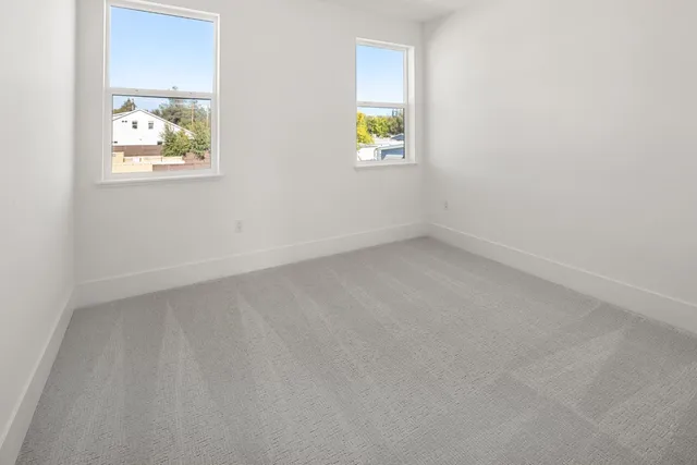 an empty room with windows