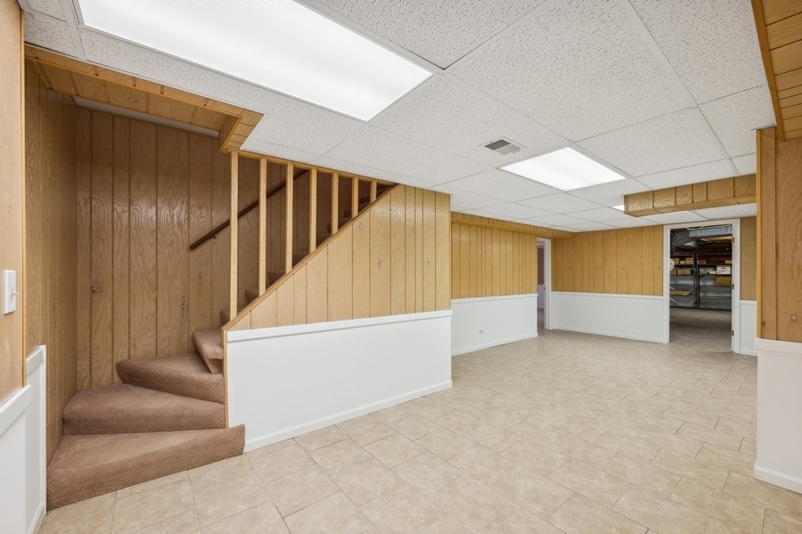 334 7 Pines Circle Highland Park, IL 60035 - Photo 15 of 19 a view of an empty room with a staircase