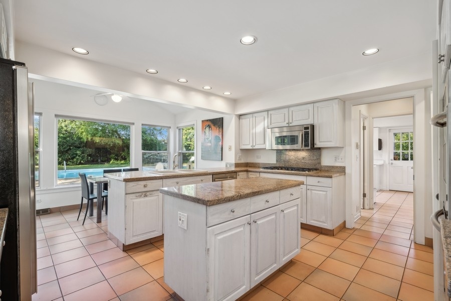 334 7 Pines Circle Highland Park, IL 60035 - Photo 2 of 19 a kitchen with a sink window and cabinets