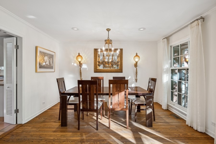334 7 Pines Circle Highland Park, IL 60035 - Photo 5 of 19 a view of a dining room with furniture window and wooden floor
