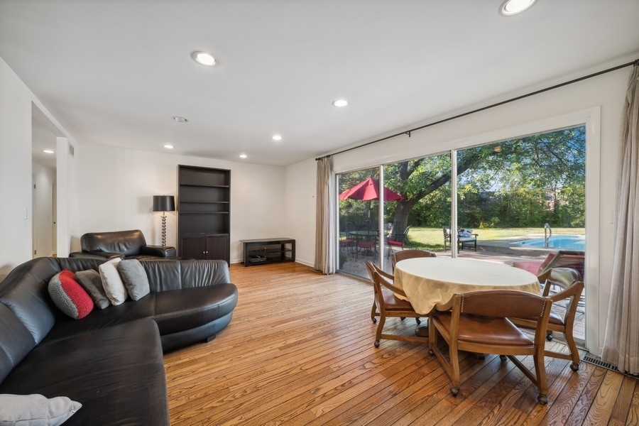 334 7 Pines Circle Highland Park, IL 60035 - Photo 6 of 19 a living room with furniture and a floor to ceiling window