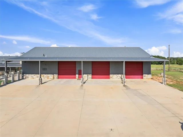 a view of a house with a yard and garage