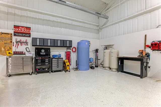 a table with chairs and a sink