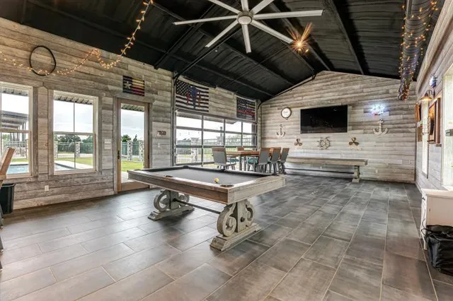 a kitchen with stainless steel appliances kitchen island granite countertop a sink and cabinets