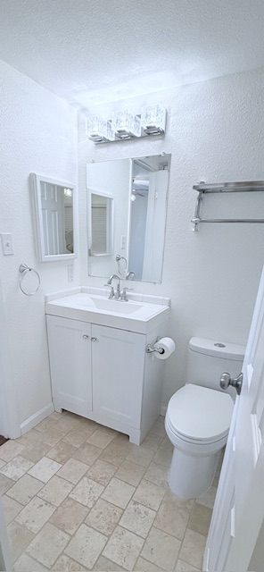 2500 Burleson Road, Unit 713 Austin, TX 78741 - Photo 8 of 15 A compact bathroom offers essential fixtures, providing both practicality and a neat appearance.