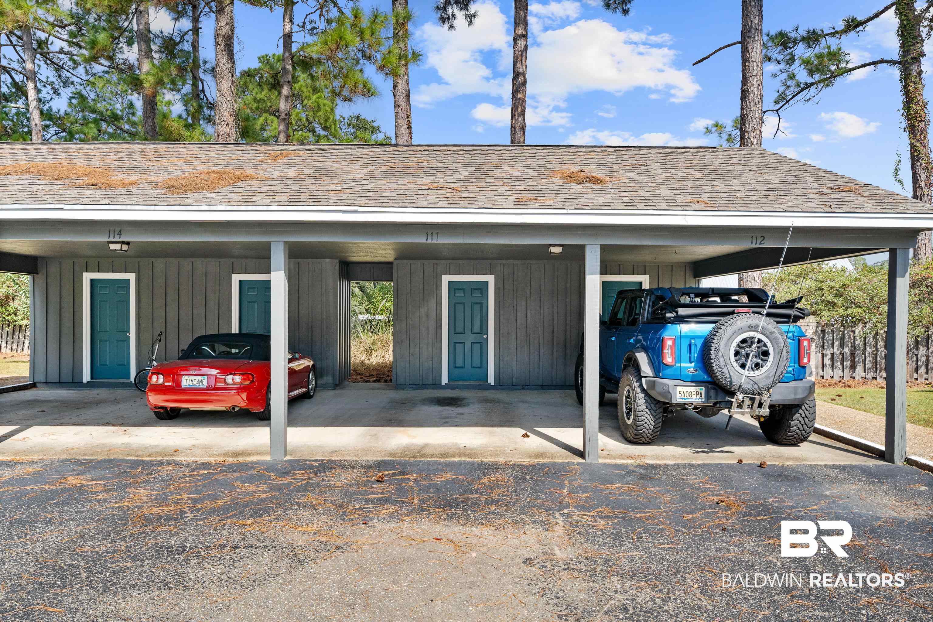 1701 Regency Road, Unit 111 Gulf Shores, AL 36542 - Photo 29 of 29 Garage with a carport
