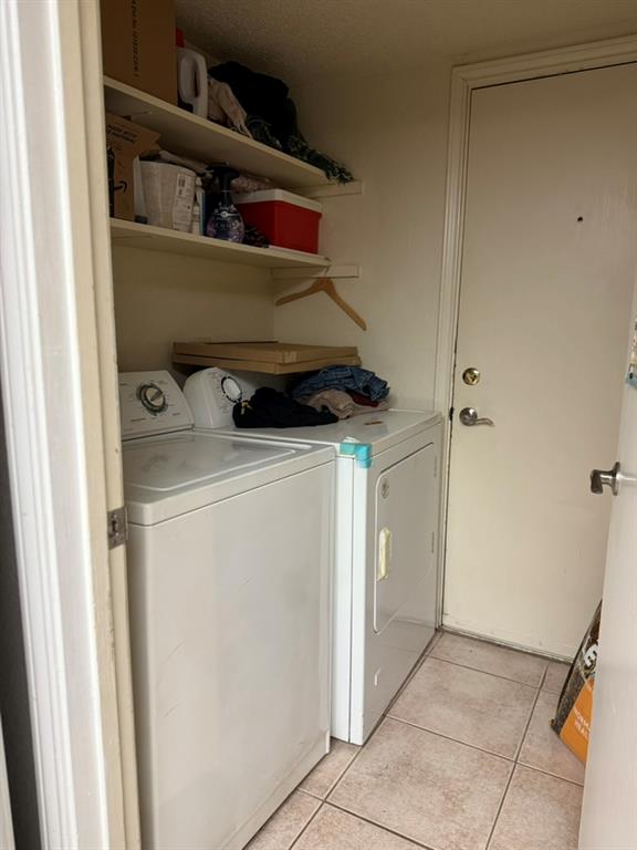 12307 Cahone Trail Austin, TX 78729 - Photo 6 of 6 a utility room with dryer and washer