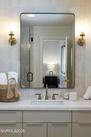 a bathroom with a sink and a mirror