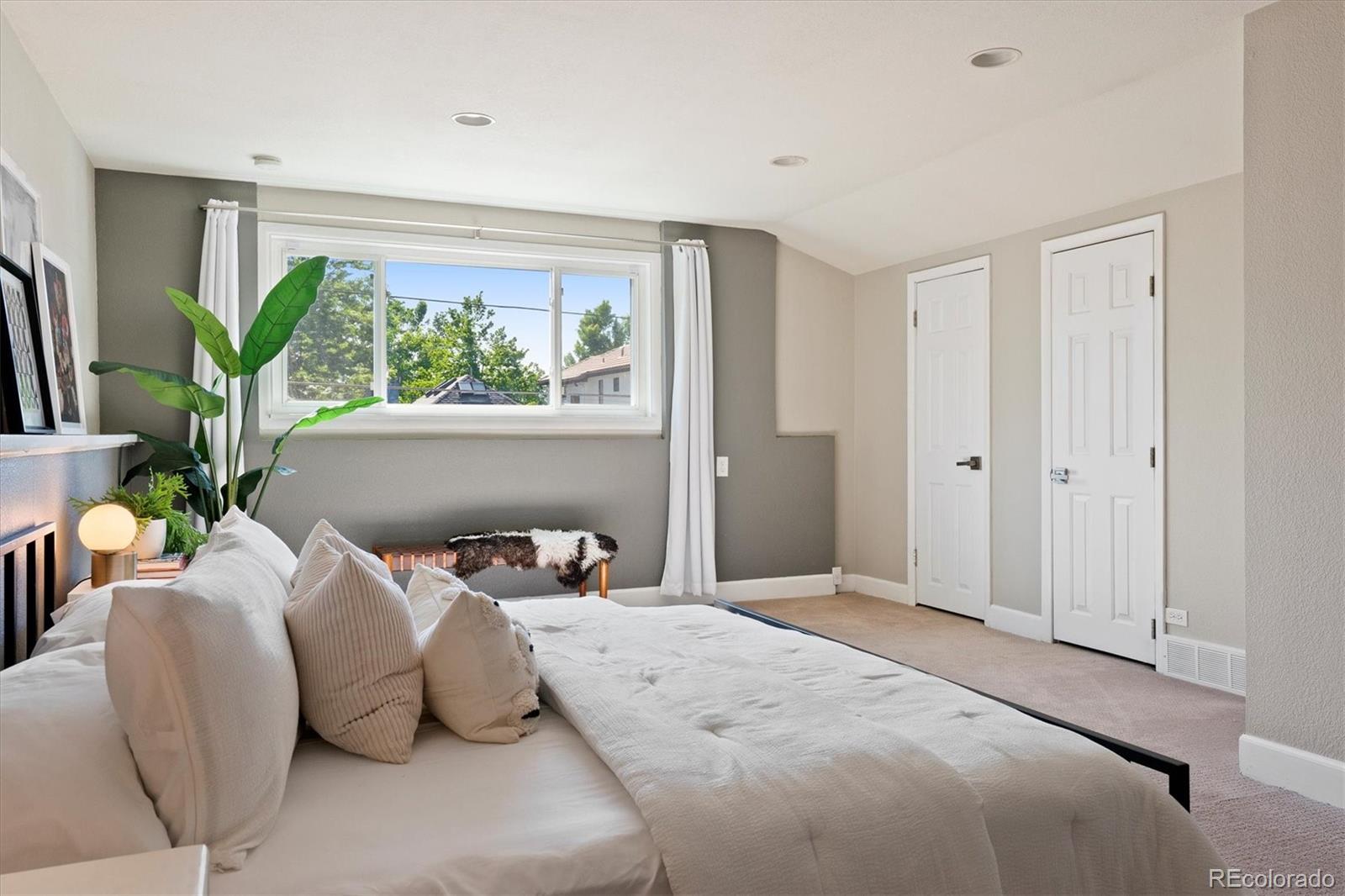 1643 South Ogden Street Denver, CO 80210 - Photo 16 of 39 a bedroom with a bed and a window