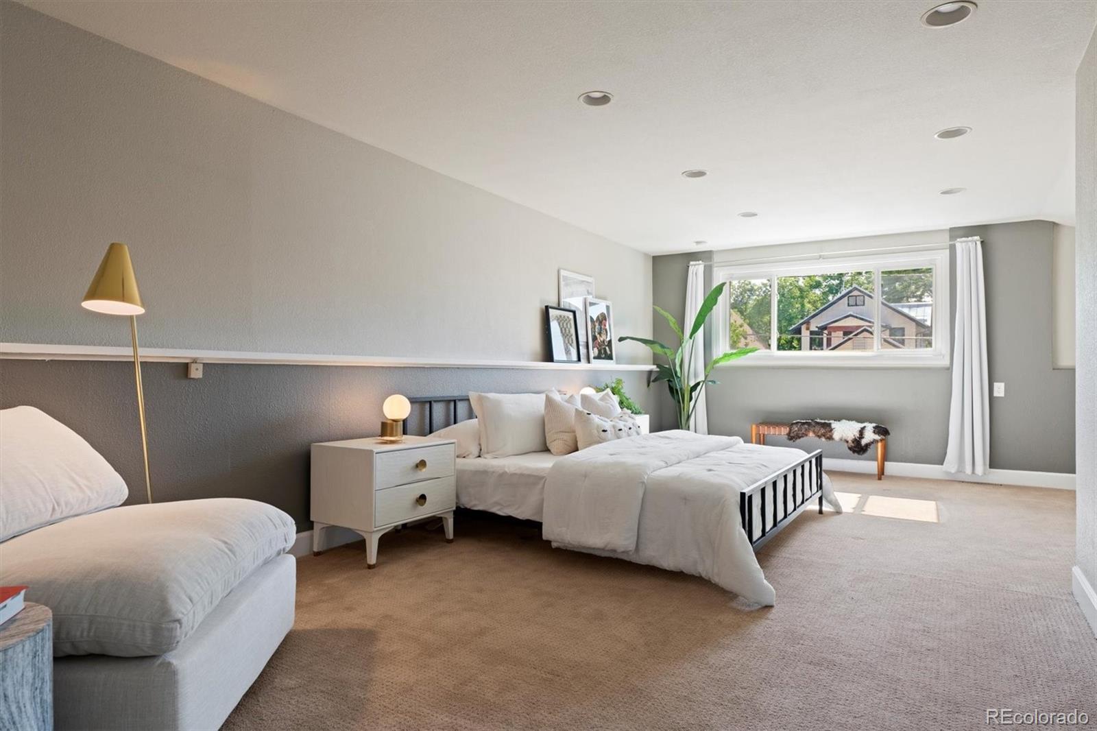 1643 South Ogden Street Denver, CO 80210 - Photo 18 of 39 a bed room with two bed and a large window