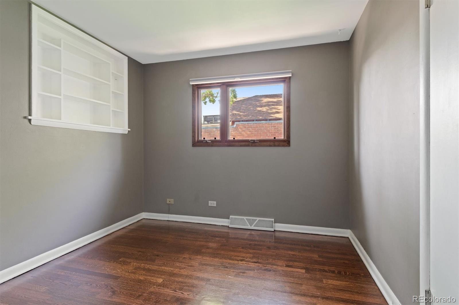 1643 South Ogden Street Denver, CO 80210 - Photo 26 of 39 a view of a room with wooden floor and window