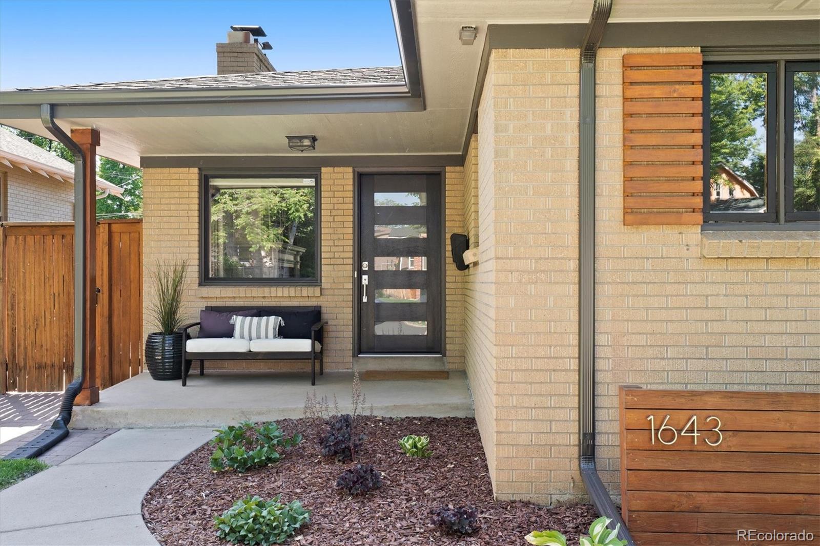 1643 South Ogden Street Denver, CO 80210 - Photo 3 of 39 a living room with furniture
